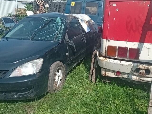 Черный Мицубиси Лансер, объемом двигателя 1.6 л и пробегом 258 тыс. км за 1600 $, фото 2 на Automoto.ua