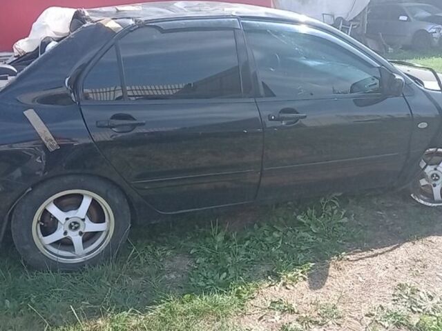 Черный Мицубиси Лансер, объемом двигателя 1.6 л и пробегом 258 тыс. км за 1600 $, фото 1 на Automoto.ua