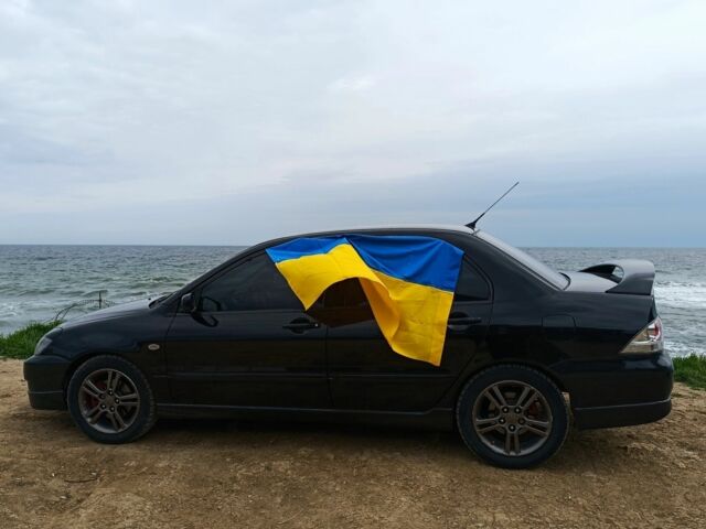 Чорний Міцубісі Lancer, об'ємом двигуна 2 л та пробігом 270 тис. км за 5000 $, фото 4 на Automoto.ua