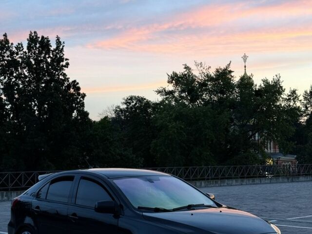 Черный Мицубиси Лансер, объемом двигателя 2 л и пробегом 190 тыс. км за 7100 $, фото 2 на Automoto.ua