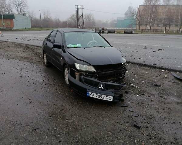 Чорний Міцубісі Lancer, об'ємом двигуна 1.6 л та пробігом 340 тис. км за 1776 $, фото 1 на Automoto.ua