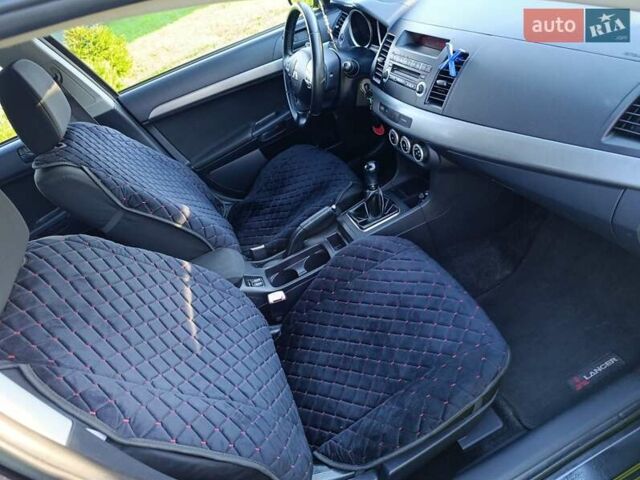 Чорний Міцубісі Lancer, об'ємом двигуна 1.8 л та пробігом 188 тис. км за 6399 $, фото 21 на Automoto.ua