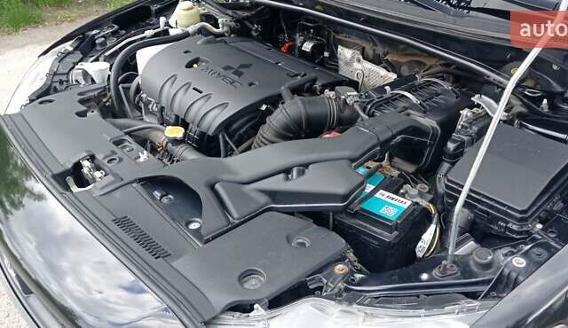 Чорний Міцубісі Lancer, об'ємом двигуна 2 л та пробігом 49 тис. км за 12500 $, фото 2 на Automoto.ua