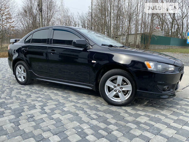 Чорний Міцубісі Lancer, об'ємом двигуна 2 л та пробігом 170 тис. км за 6999 $, фото 8 на Automoto.ua