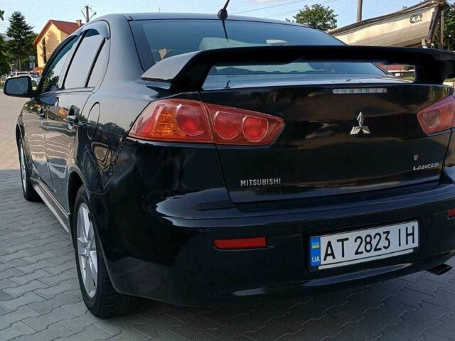 Чорний Міцубісі Lancer, об'ємом двигуна 2 л та пробігом 145 тис. км за 5200 $, фото 6 на Automoto.ua