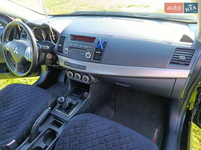 Чорний Міцубісі Lancer, об'ємом двигуна 1.8 л та пробігом 188 тис. км за 6399 $, фото 28 на Automoto.ua