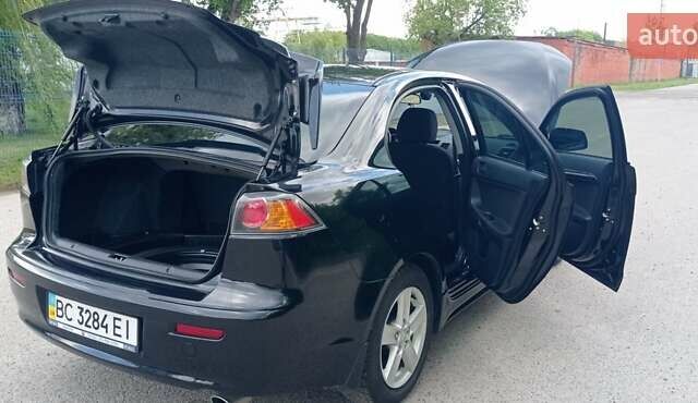 Чорний Міцубісі Lancer, об'ємом двигуна 2 л та пробігом 49 тис. км за 12500 $, фото 4 на Automoto.ua
