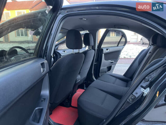 Чорний Міцубісі Lancer, об'ємом двигуна 1.8 л та пробігом 138 тис. км за 6777 $, фото 48 на Automoto.ua