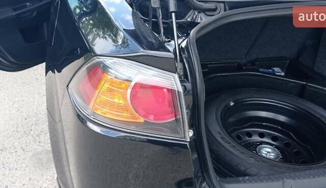 Чорний Міцубісі Lancer, об'ємом двигуна 2 л та пробігом 49 тис. км за 12500 $, фото 1 на Automoto.ua