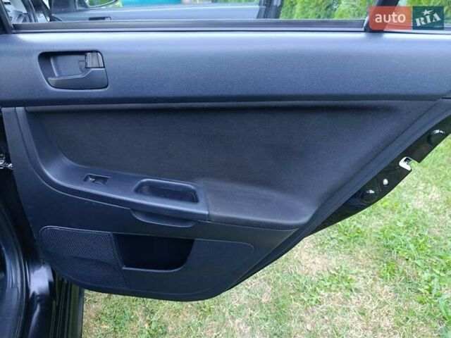 Чорний Міцубісі Lancer, об'ємом двигуна 1.8 л та пробігом 188 тис. км за 6399 $, фото 7 на Automoto.ua