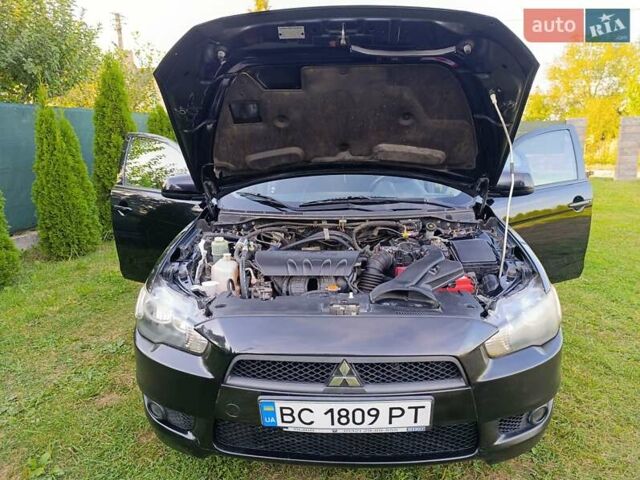 Чорний Міцубісі Lancer, об'ємом двигуна 1.8 л та пробігом 188 тис. км за 6399 $, фото 10 на Automoto.ua