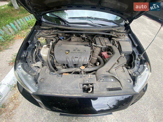 Чорний Міцубісі Lancer, об'ємом двигуна 1.8 л та пробігом 210 тис. км за 6499 $, фото 6 на Automoto.ua