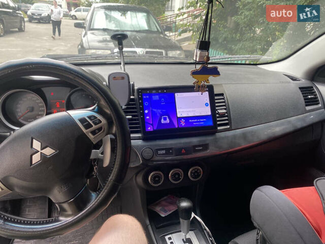 Черный Мицубиси Лансер, объемом двигателя 1.8 л и пробегом 218 тыс. км за 6800 $, фото 9 на Automoto.ua