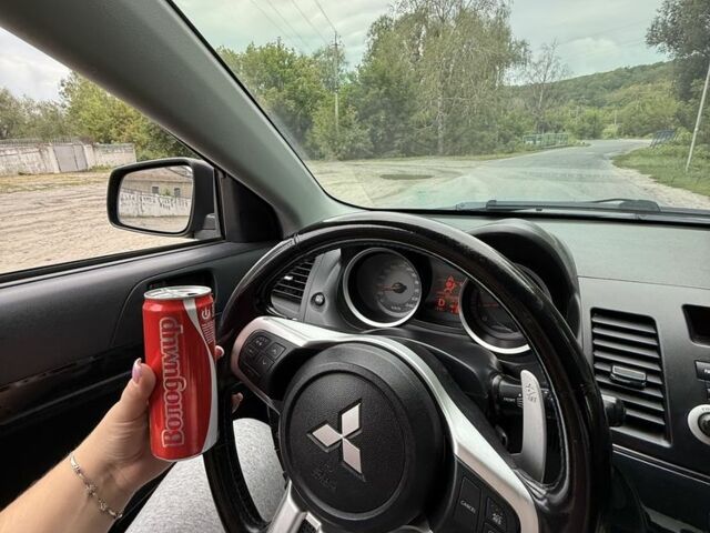 Черный Мицубиси Лансер, объемом двигателя 2 л и пробегом 190 тыс. км за 7100 $, фото 6 на Automoto.ua