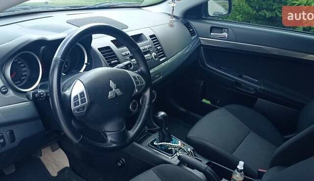 Чорний Міцубісі Lancer, об'ємом двигуна 2 л та пробігом 49 тис. км за 12500 $, фото 18 на Automoto.ua