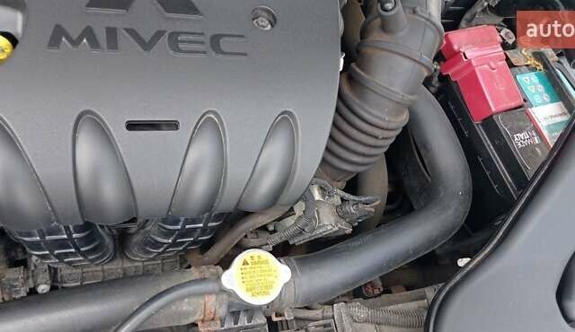 Чорний Міцубісі Lancer, об'ємом двигуна 2 л та пробігом 49 тис. км за 12500 $, фото 14 на Automoto.ua