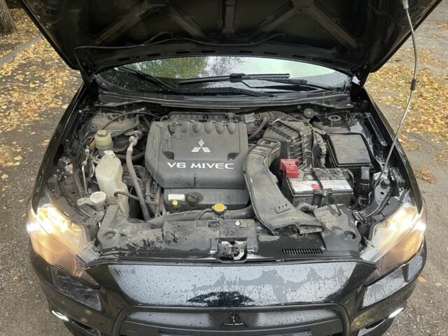 Черный Мицубиси Лансер, объемом двигателя 2 л и пробегом 190 тыс. км за 7100 $, фото 7 на Automoto.ua