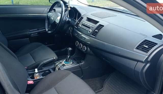 Чорний Міцубісі Lancer, об'ємом двигуна 2 л та пробігом 49 тис. км за 12500 $, фото 27 на Automoto.ua