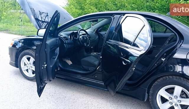 Чорний Міцубісі Lancer, об'ємом двигуна 2 л та пробігом 49 тис. км за 12500 $, фото 3 на Automoto.ua