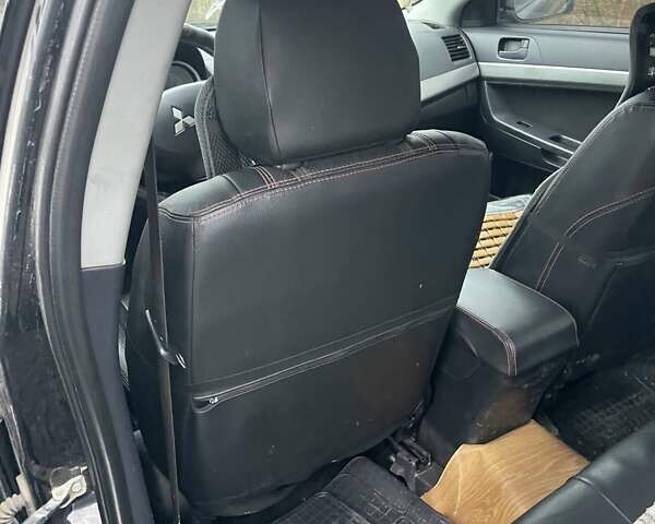 Черный Мицубиси Лансер, объемом двигателя 2 л и пробегом 260 тыс. км за 6000 $, фото 11 на Automoto.ua