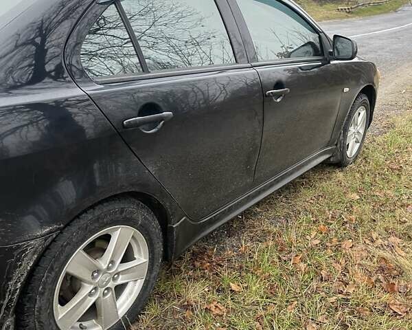 Черный Мицубиси Лансер, объемом двигателя 2 л и пробегом 260 тыс. км за 6000 $, фото 4 на Automoto.ua