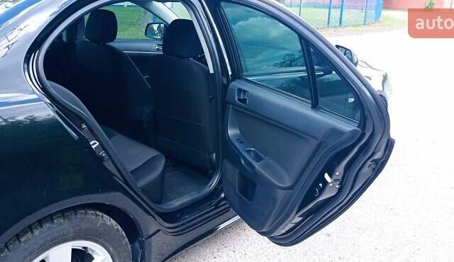 Чорний Міцубісі Lancer, об'ємом двигуна 2 л та пробігом 49 тис. км за 12500 $, фото 28 на Automoto.ua