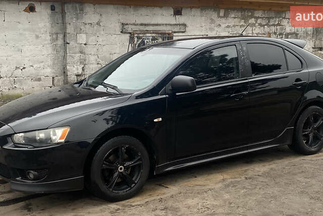 Черный Мицубиси Лансер, объемом двигателя 1.8 л и пробегом 218 тыс. км за 6800 $, фото 1 на Automoto.ua