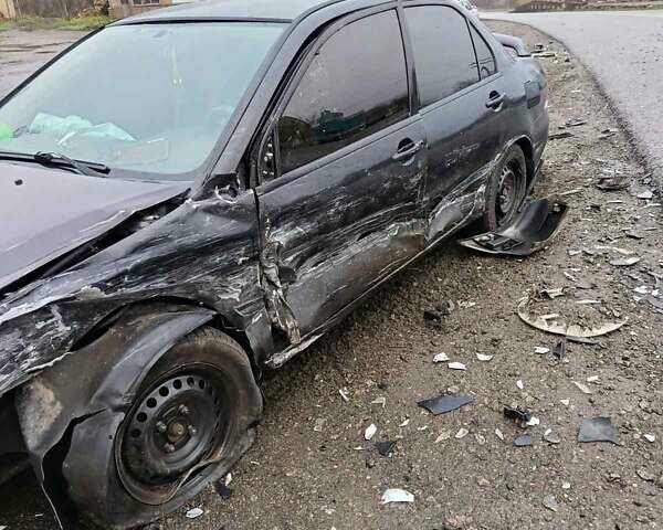 Чорний Міцубісі Lancer, об'ємом двигуна 1.6 л та пробігом 340 тис. км за 1776 $, фото 3 на Automoto.ua