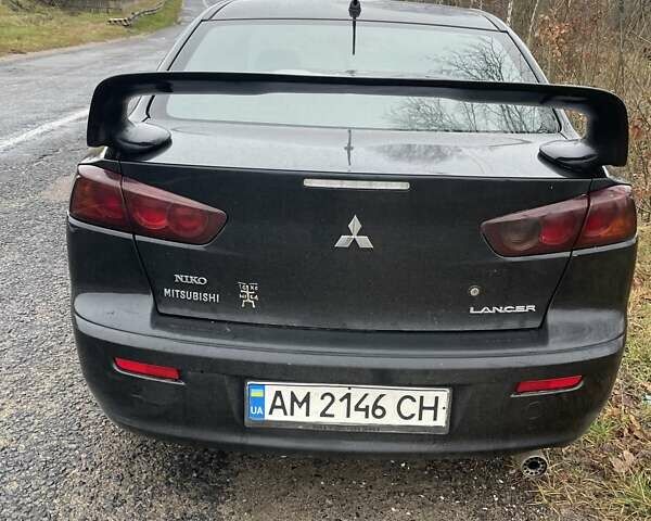 Черный Мицубиси Лансер, объемом двигателя 2 л и пробегом 260 тыс. км за 6000 $, фото 5 на Automoto.ua