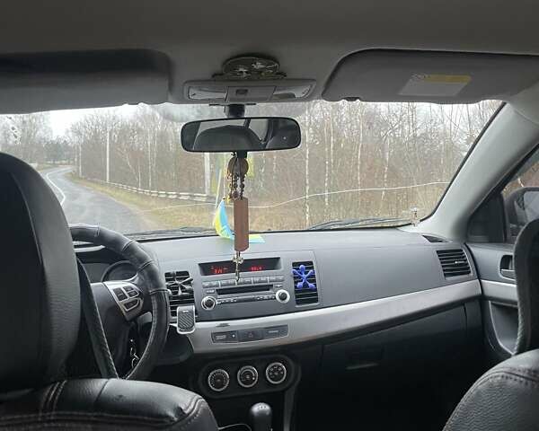 Черный Мицубиси Лансер, объемом двигателя 2 л и пробегом 260 тыс. км за 6000 $, фото 8 на Automoto.ua