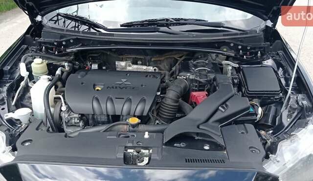 Чорний Міцубісі Lancer, об'ємом двигуна 2 л та пробігом 49 тис. км за 12500 $, фото 22 на Automoto.ua