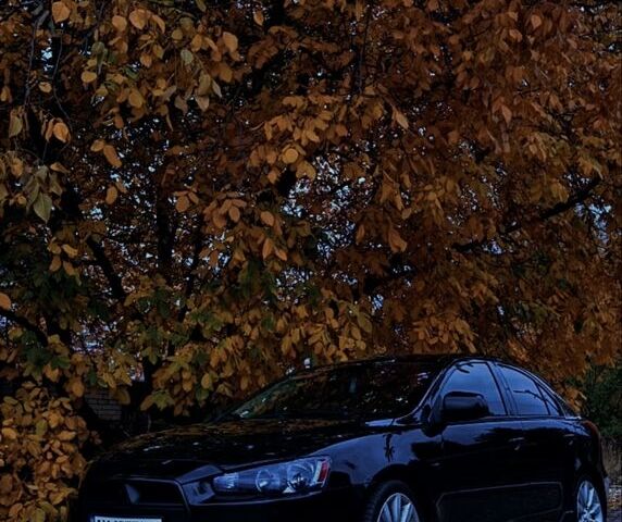 Черный Мицубиси Лансер, объемом двигателя 2 л и пробегом 190 тыс. км за 7100 $, фото 1 на Automoto.ua