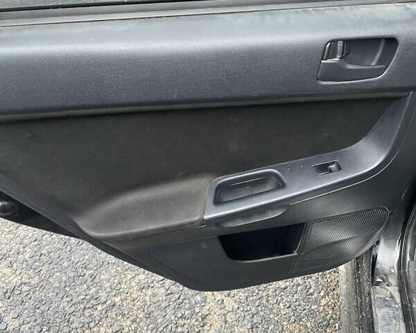 Черный Мицубиси Лансер, объемом двигателя 2 л и пробегом 260 тыс. км за 6000 $, фото 2 на Automoto.ua