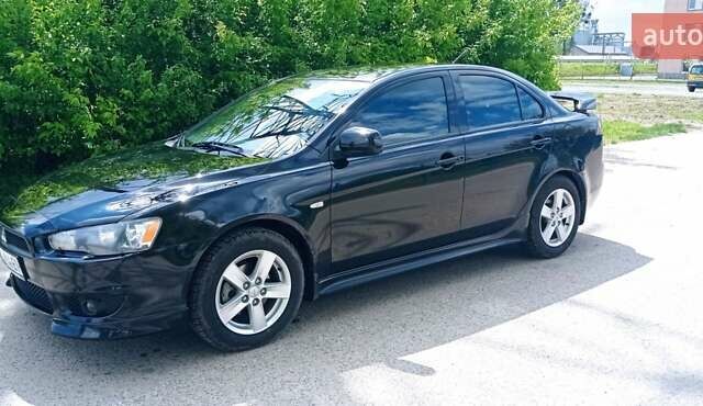 Чорний Міцубісі Lancer, об'ємом двигуна 2 л та пробігом 49 тис. км за 12500 $, фото 43 на Automoto.ua