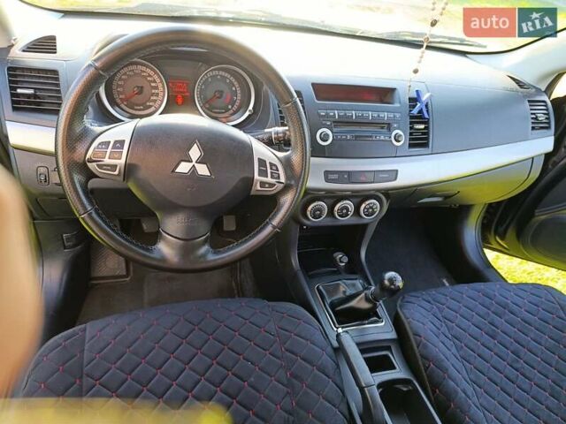 Чорний Міцубісі Lancer, об'ємом двигуна 1.8 л та пробігом 188 тис. км за 6399 $, фото 27 на Automoto.ua