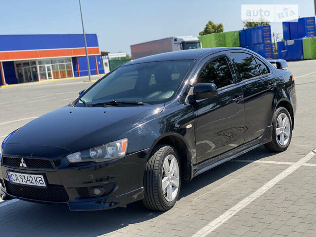 Чорний Міцубісі Lancer, об'ємом двигуна 2 л та пробігом 170 тис. км за 7000 $, фото 1 на Automoto.ua