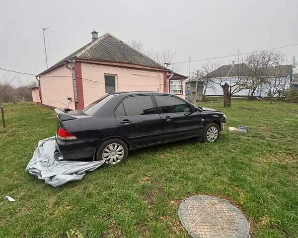 Чорний Міцубісі Lancer, об'ємом двигуна 1.6 л та пробігом 340 тис. км за 1776 $, фото 4 на Automoto.ua