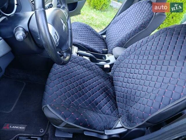 Чорний Міцубісі Lancer, об'ємом двигуна 1.8 л та пробігом 188 тис. км за 6399 $, фото 6 на Automoto.ua