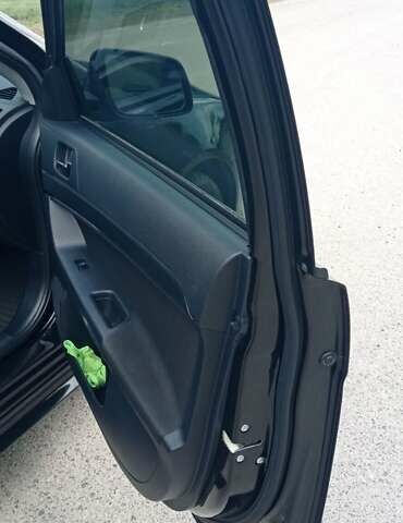 Чорний Міцубісі Lancer, об'ємом двигуна 2 л та пробігом 49 тис. км за 12500 $, фото 23 на Automoto.ua