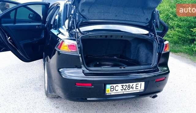 Чорний Міцубісі Lancer, об'ємом двигуна 2 л та пробігом 49 тис. км за 12500 $, фото 6 на Automoto.ua