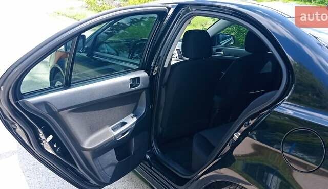 Чорний Міцубісі Lancer, об'ємом двигуна 2 л та пробігом 49 тис. км за 12500 $, фото 39 на Automoto.ua