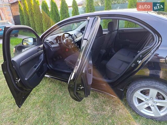 Чорний Міцубісі Lancer, об'ємом двигуна 1.8 л та пробігом 188 тис. км за 6399 $, фото 14 на Automoto.ua