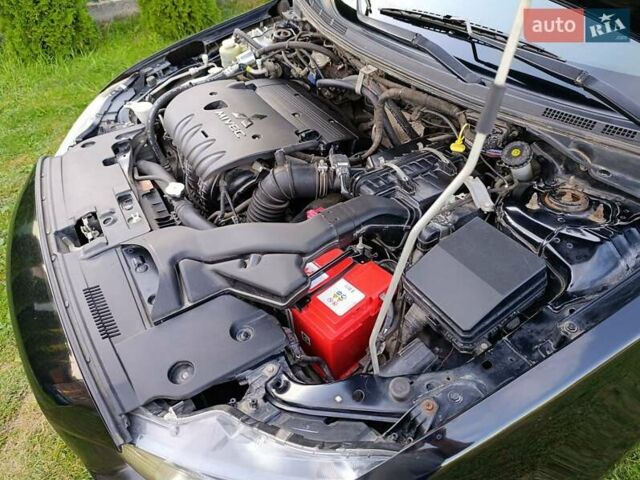 Чорний Міцубісі Lancer, об'ємом двигуна 1.8 л та пробігом 188 тис. км за 6399 $, фото 11 на Automoto.ua