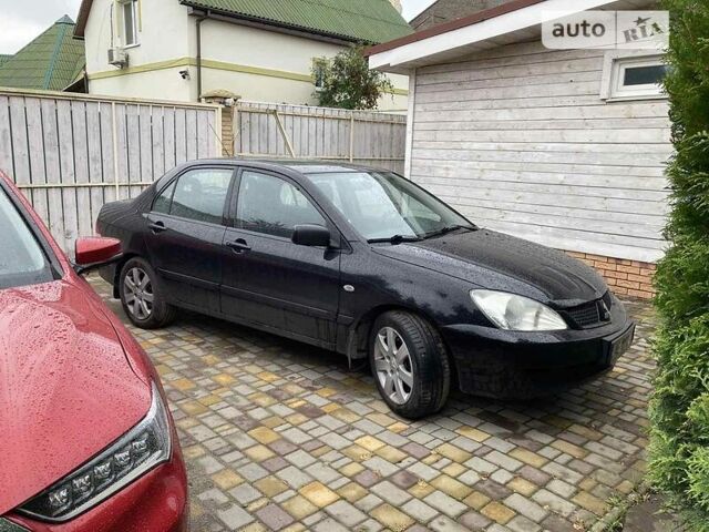 Чорний Міцубісі Lancer, об'ємом двигуна 1.6 л та пробігом 217 тис. км за 6000 $, фото 3 на Automoto.ua