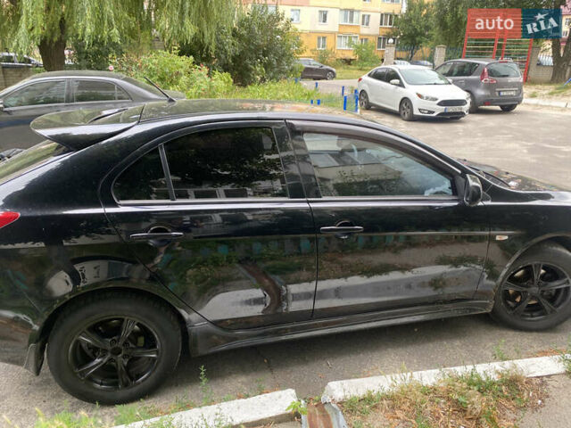 Чорний Міцубісі Lancer, об'ємом двигуна 1.8 л та пробігом 210 тис. км за 6499 $, фото 5 на Automoto.ua