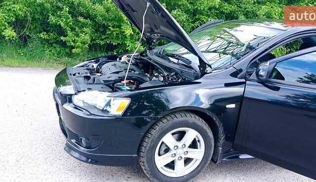 Чорний Міцубісі Lancer, об'ємом двигуна 2 л та пробігом 49 тис. км за 12500 $, фото 8 на Automoto.ua