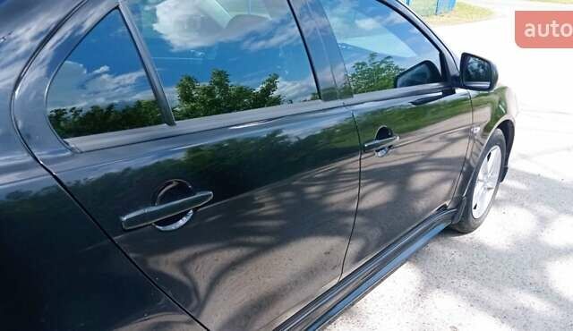 Чорний Міцубісі Lancer, об'ємом двигуна 2 л та пробігом 49 тис. км за 12500 $, фото 41 на Automoto.ua