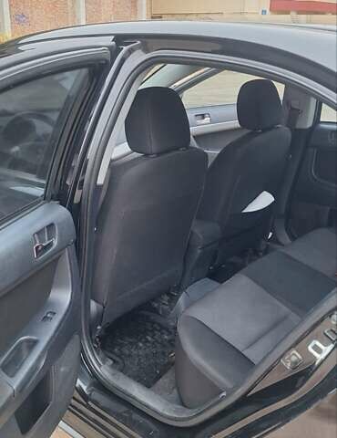 Чорний Міцубісі Lancer, об'ємом двигуна 1.8 л та пробігом 213 тис. км за 6200 $, фото 9 на Automoto.ua