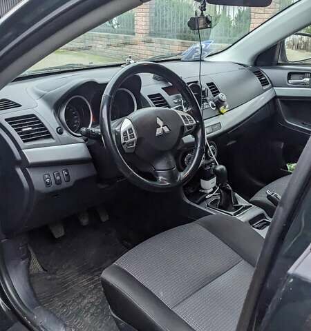 Черный Мицубиси Лансер, объемом двигателя 1.8 л и пробегом 210 тыс. км за 7300 $, фото 1 на Automoto.ua