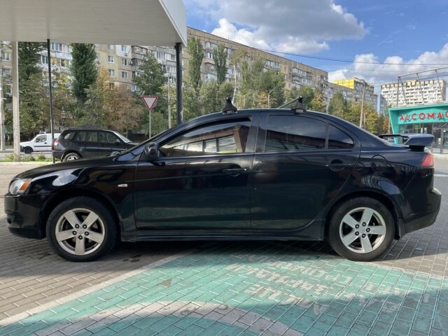 Чорний Міцубісі Lancer, об'ємом двигуна 2 л та пробігом 400 тис. км за 4900 $, фото 6 на Automoto.ua